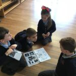pupils sitting reading