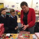 pupils creating xmas shoe box parcels