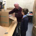 pupils creating xmas shoe box parcels