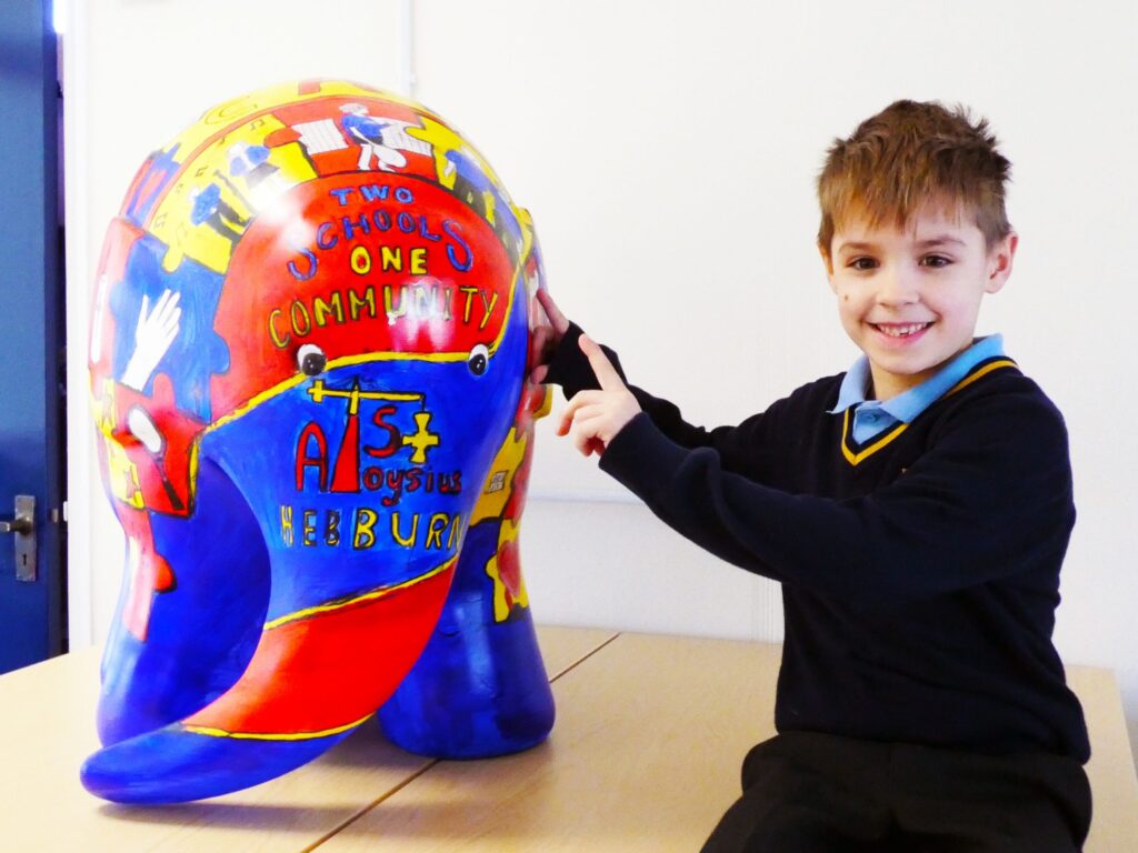 pupil pointing to model elephant