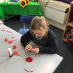 Pupils creating poppies