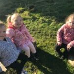 small children sitting in a circle