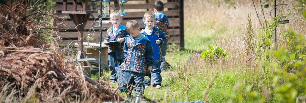 young children playing in the garden